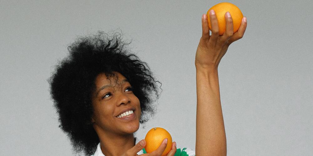 Woman holding oranges
