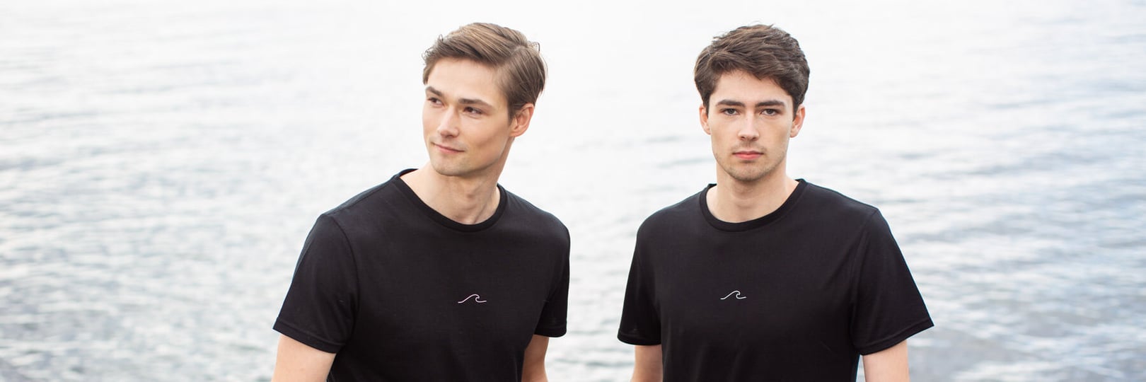 Men in Oceanness eco t-shirt collection at the pier